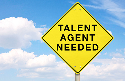 A street sign saying Talent Agent Needed