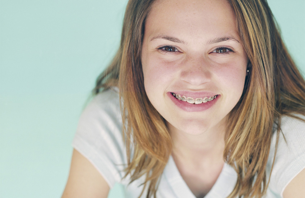 A pretty young girl smiles happily