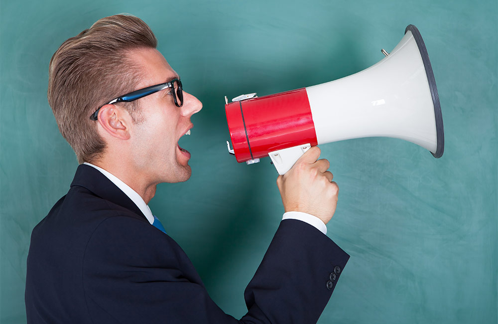 Man shouting into a megaphone