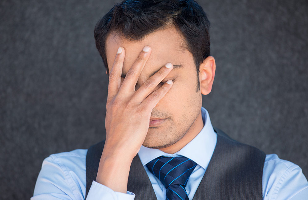 A man looking frustrated and discouraged