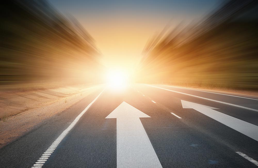 A roadway stretches toward the horizon